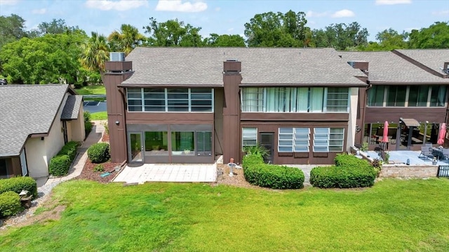 683 Midway Dr Unit B, Ocala, FL 34472 - back of property with a patio area, a yard, and a shingled roof