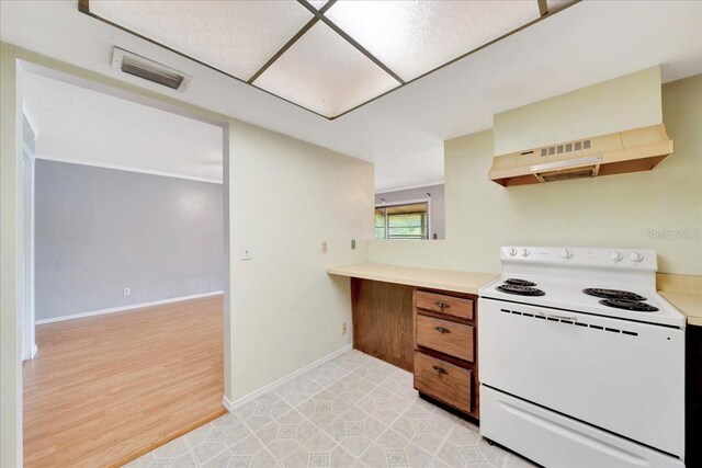 683 Midway Dr Unit B, Ocala, FL 34472 - kitchen with white electric stove, extractor fan, light countertops, brown cabinets, and light wood finished floors