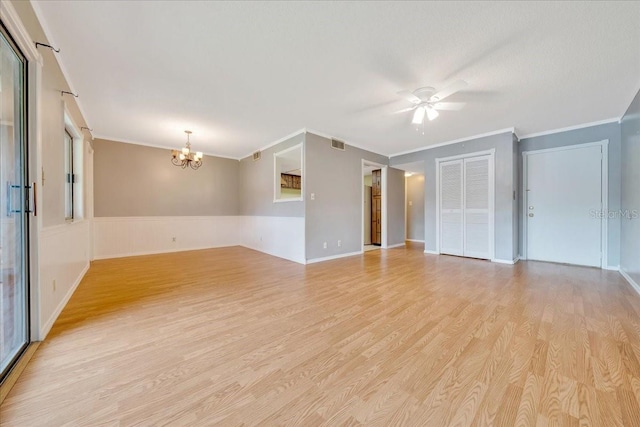 683 Midway Dr Unit B, Ocala, FL 34472 - spare room with a chandelier, light wood-type flooring, ornamental molding, and ceiling fan