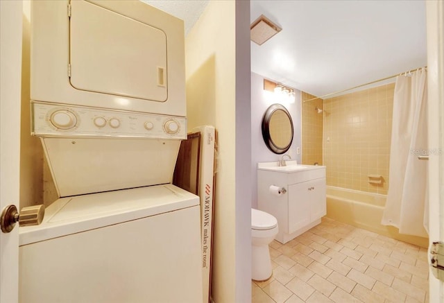 683 Midway Dr Unit B, Ocala, FL 34472 - bathroom featuring stacked washer / drying machine, shower / bath combo with shower curtain, tile patterned floors, and vanity
