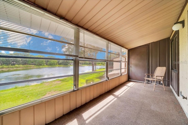 683 Midway Dr Unit B, Ocala, FL 34472 - unfurnished sunroom with a water view and lofted ceiling