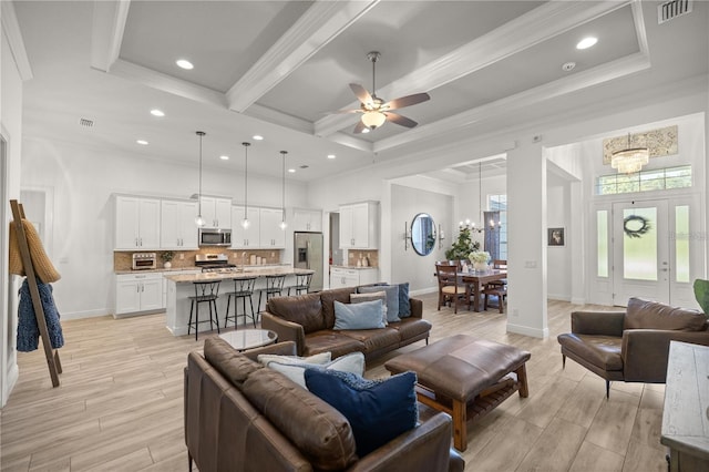 3993 SE 10th Ave, Ocala, FL 34480 - living area with a chandelier, ceiling fan, light wood finished floors, ornamental molding, and recessed lighting