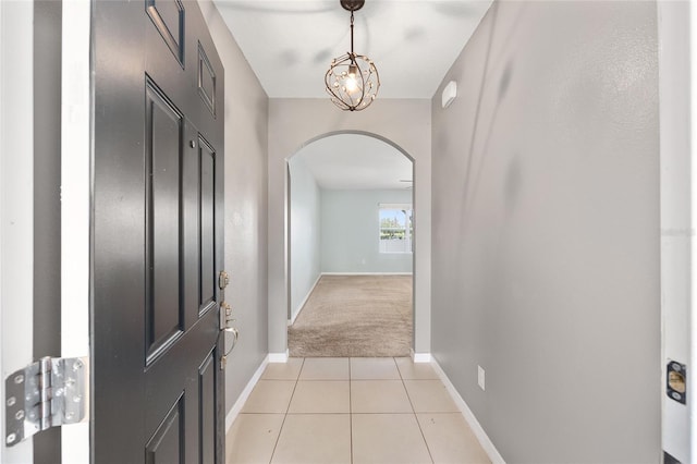7054 SW 64th Ter, Ocala, FL 34476 - entryway with arched walkways, light carpet, and light tile patterned floors
