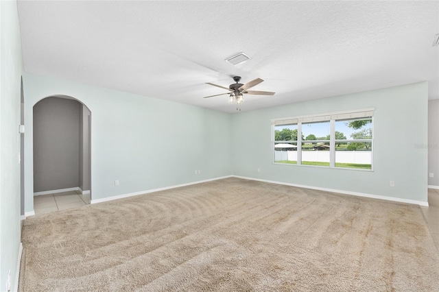 7054 SW 64th Ter, Ocala, FL 34476 - unfurnished room with ceiling fan, arched walkways, and carpet floors