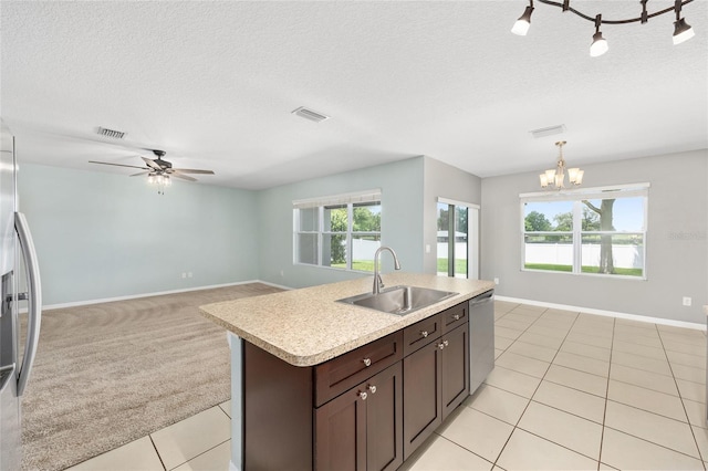 7054 SW 64th Ter, Ocala, FL 34476 - kitchen featuring appliances with stainless steel finishes, light countertops, light tile patterned floors, a chandelier, and dark brown cabinetry