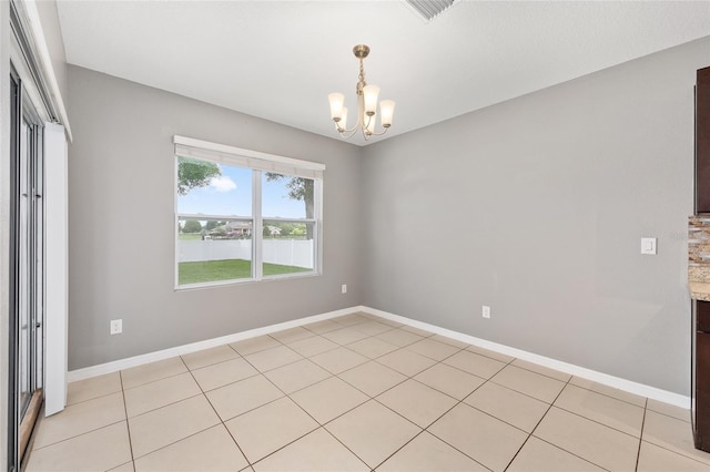 7054 SW 64th Ter, Ocala, FL 34476 - spare room with a chandelier, a water view, and light tile patterned floors