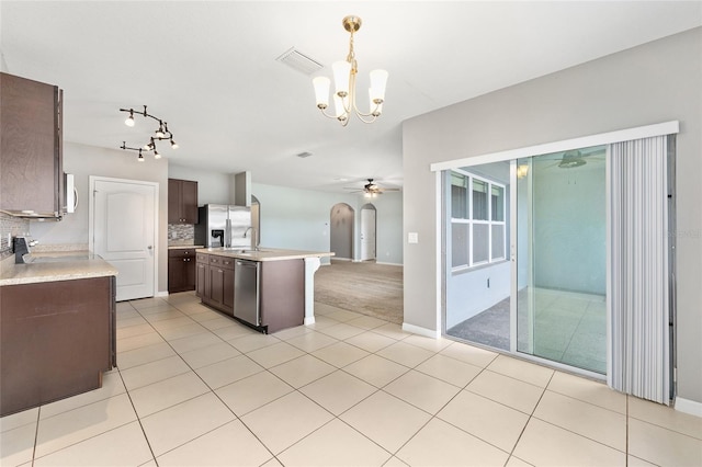 7054 SW 64th Ter, Ocala, FL 34476 - kitchen featuring stainless steel appliances, dark brown cabinets, a ceiling fan, and light countertops