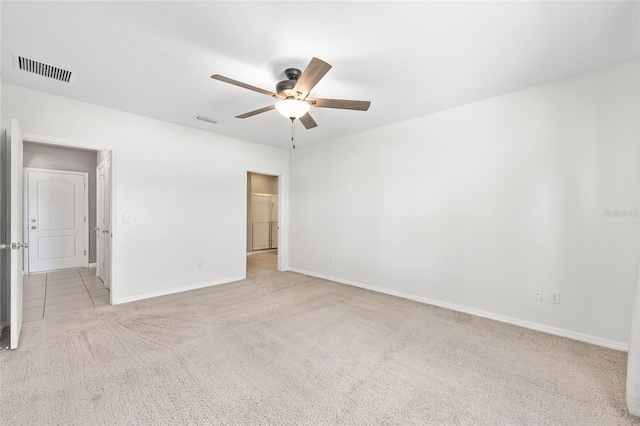 7054 SW 64th Ter, Ocala, FL 34476 - unfurnished bedroom with carpet floors, a ceiling fan, and a walk in closet