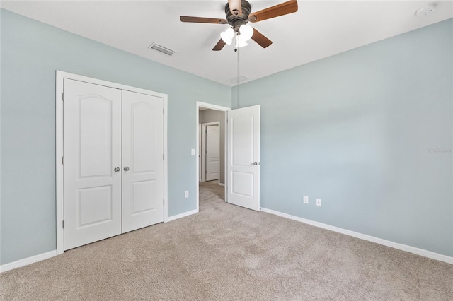 7054 SW 64th Ter, Ocala, FL 34476 - unfurnished bedroom with carpet flooring, a closet, and a ceiling fan