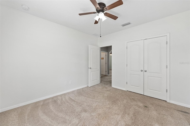 7054 SW 64th Ter, Ocala, FL 34476 - unfurnished bedroom with carpet floors, a closet, and a ceiling fan