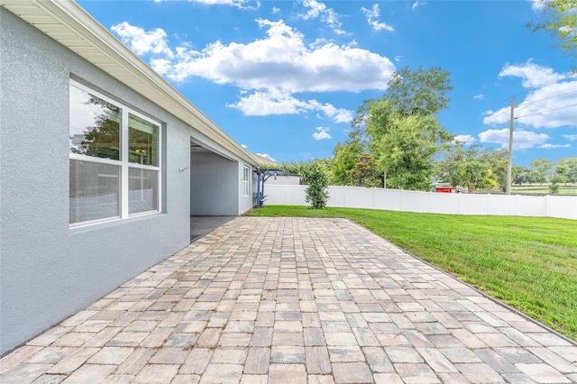 7054 SW 64th Ter, Ocala, FL 34476 - fenced backyard with a patio