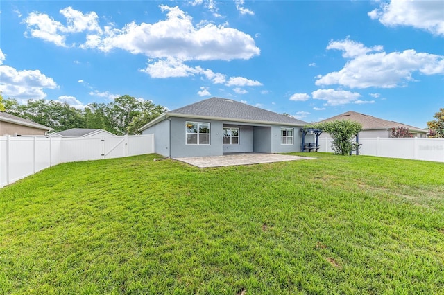 7054 SW 64th Ter, Ocala, FL 34476 - back of property featuring a patio area, a gate, a fenced backyard, and stucco siding