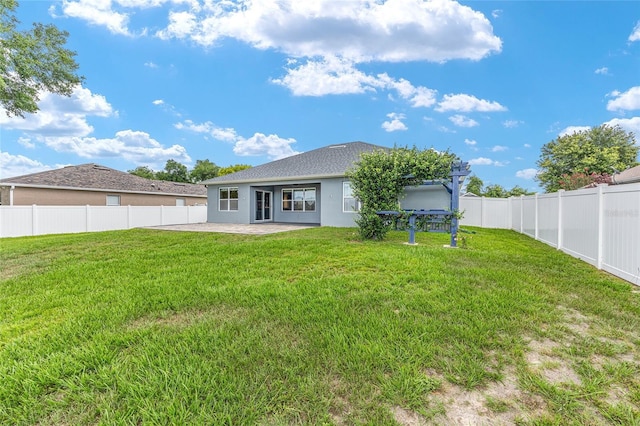 7054 SW 64th Ter, Ocala, FL 34476 - rear view of property featuring a fenced backyard, a patio area, and stucco siding