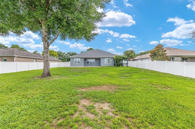 7054 SW 64th Ter, Ocala, FL 34476 - back of property with a fenced backyard and stucco siding