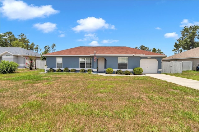 14762 SW 22nd Court Rd, Ocala, FL 34473 - single story home with stucco siding, driveway, and a garage