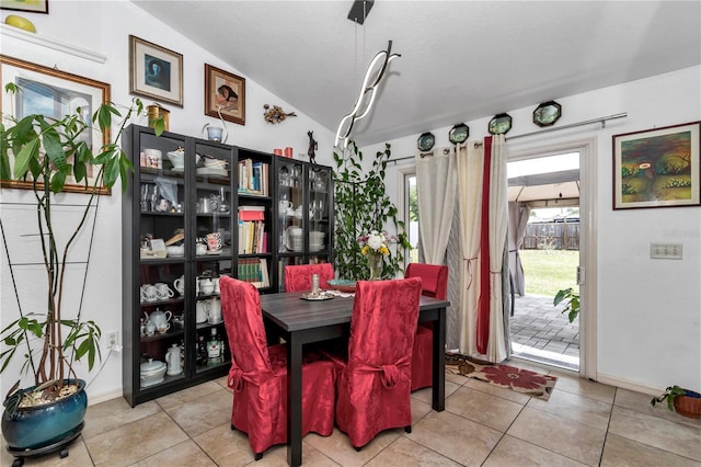 14762 SW 22nd Court Rd, Ocala, FL 34473 - dining space featuring lofted ceiling and tile patterned flooring