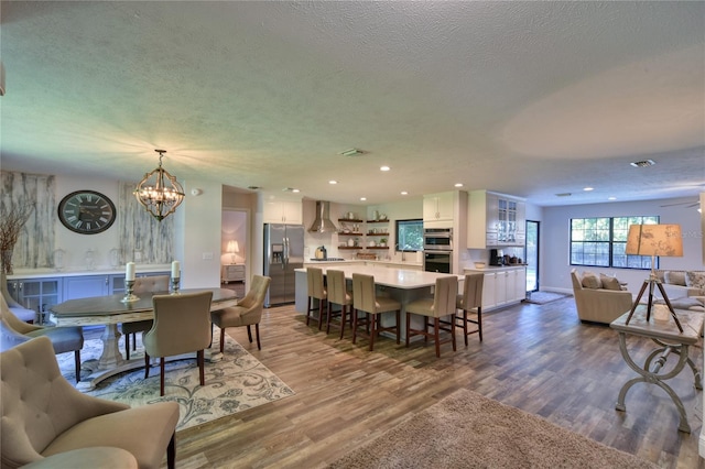 2855 SE 38th St, Ocala, FL 34480 - dining area with a chandelier, a textured ceiling, dark wood-style flooring, and recessed lighting