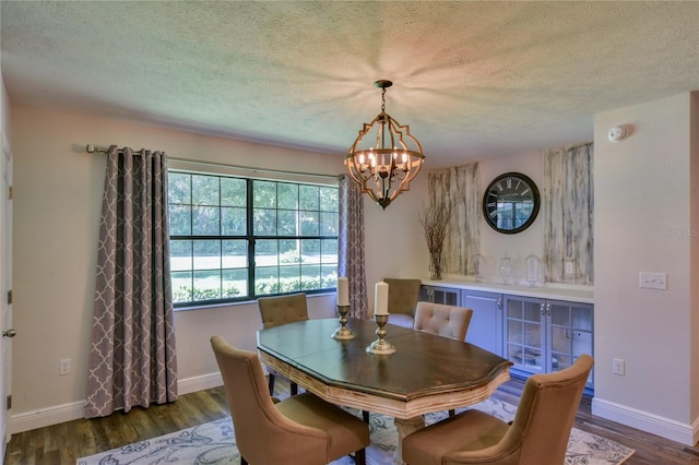 2855 SE 38th St, Ocala, FL 34480 - dining room with a textured ceiling, a chandelier, and dark wood finished floors
