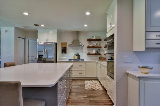 2855 SE 38th St, Ocala, FL 34480 - kitchen with stainless steel fridge, wall chimney exhaust hood, open shelves, dark wood-type flooring, and a kitchen island