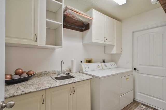 2855 SE 38th St, Ocala, FL 34480 - washroom featuring cabinet space, washing machine and clothes dryer, and wood finished floors