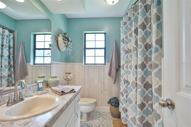 2855 SE 38th St, Ocala, FL 34480 - bathroom with vanity, wainscoting, curtained shower, and wooden walls