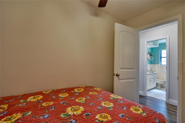2855 SE 38th St, Ocala, FL 34480 - bedroom with dark wood-style floors, ensuite bath, and ceiling fan