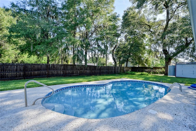 2855 SE 38th St, Ocala, FL 34480 - view of swimming pool with a fenced backyard and an outbuilding