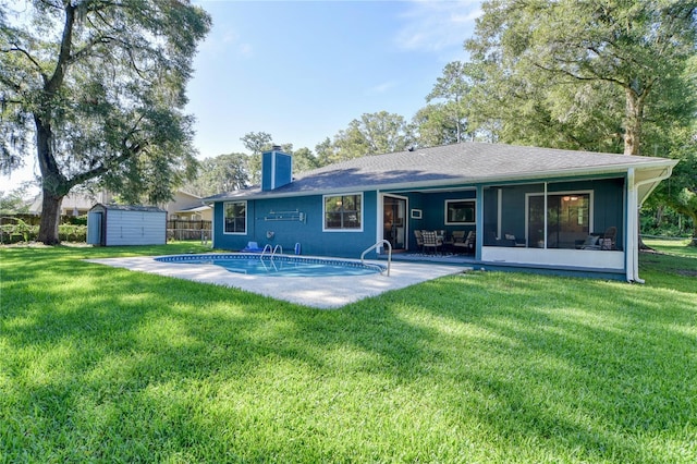 2855 SE 38th St, Ocala, FL 34480 - back of property featuring a storage unit, a chimney, a sunroom, a patio area, and roof with shingles
