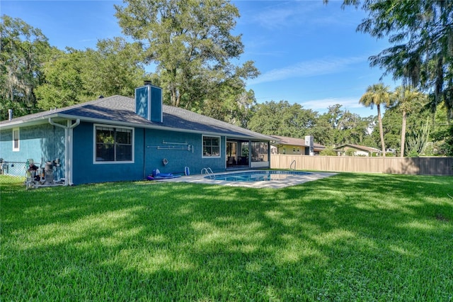2855 SE 38th St, Ocala, FL 34480 - back of house with a chimney, a patio area, a shingled roof, and stucco siding