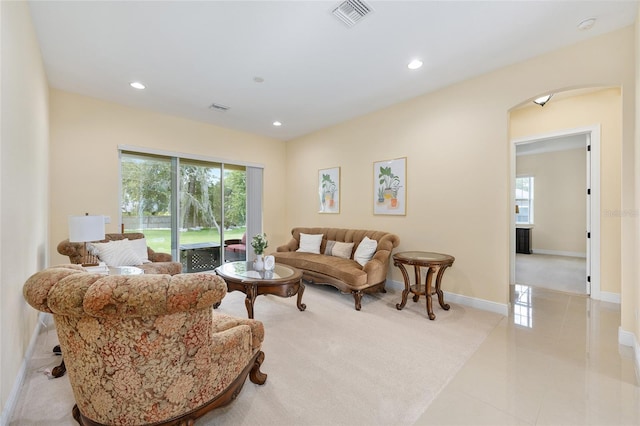 5024 SW 114th Street Rd, Ocala, FL 34476 - living area with arched walkways, recessed lighting, and light tile patterned flooring