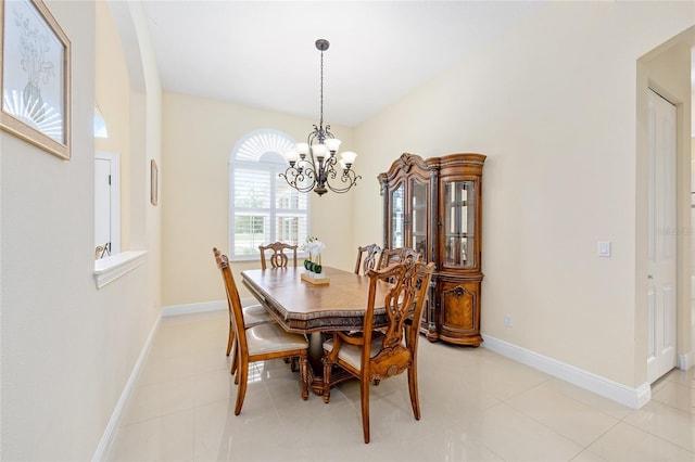 5024 SW 114th Street Rd, Ocala, FL 34476 - dining space featuring a chandelier, arched walkways, and light tile patterned floors