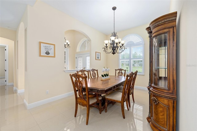 5024 SW 114th Street Rd, Ocala, FL 34476 - dining room featuring a chandelier and arched walkways