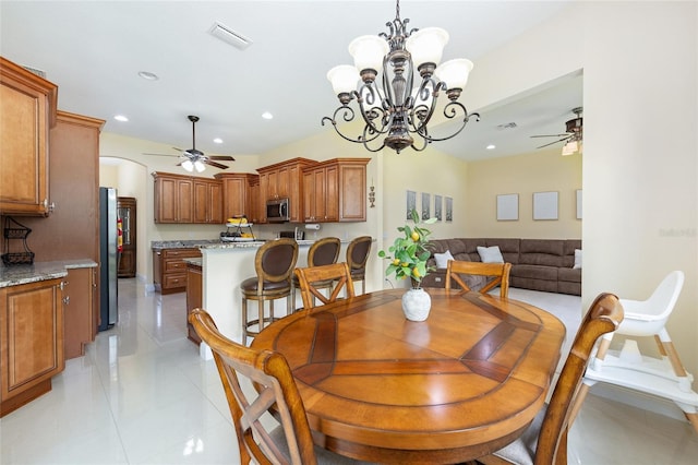 5024 SW 114th Street Rd, Ocala, FL 34476 - dining area featuring ceiling fan, a chandelier, light tile patterned flooring, recessed lighting, and arched walkways