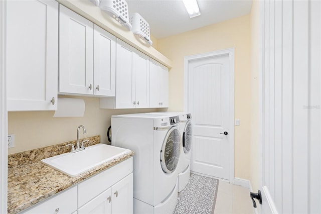 5024 SW 114th Street Rd, Ocala, FL 34476 - laundry area with washing machine and clothes dryer, cabinet space, and tile patterned floors