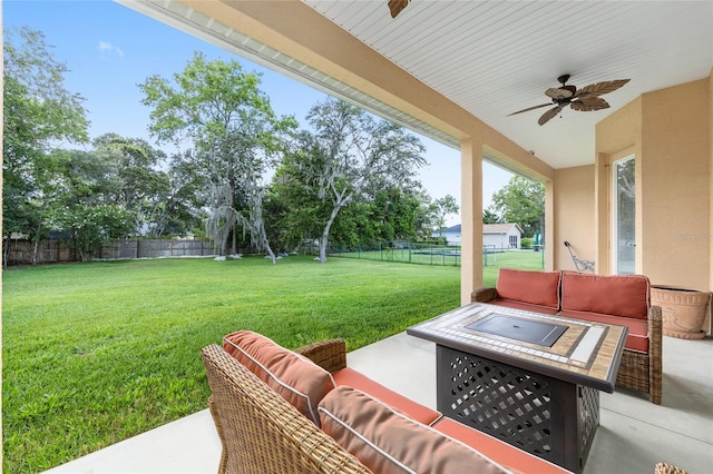 5024 SW 114th Street Rd, Ocala, FL 34476 - fenced backyard with a ceiling fan, an outdoor living space, and a patio area