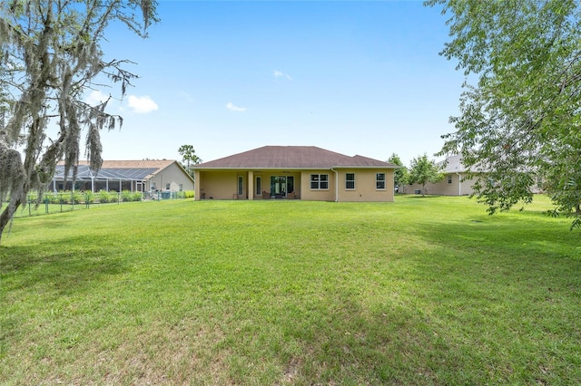 5024 SW 114th Street Rd, Ocala, FL 34476 - rear view of property featuring a yard and stucco siding