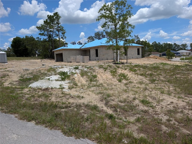 13322 SW 85th Cir, Ocala, FL 34473 - back of property with a garage and concrete block siding