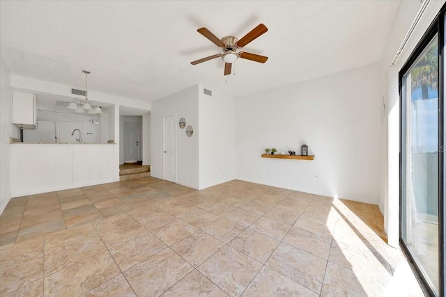 329 Marion Oaks Blvd Unit A3, Ocala, FL 34473 - unfurnished living room with a sink and a ceiling fan