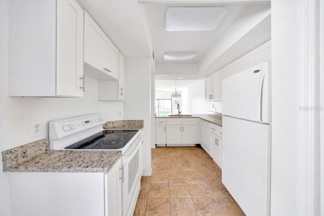 329 Marion Oaks Blvd Unit A3, Ocala, FL 34473 - kitchen with white appliances and white cabinetry