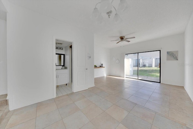 329 Marion Oaks Blvd Unit A3, Ocala, FL 34473 - empty room with ceiling fan and light tile patterned flooring
