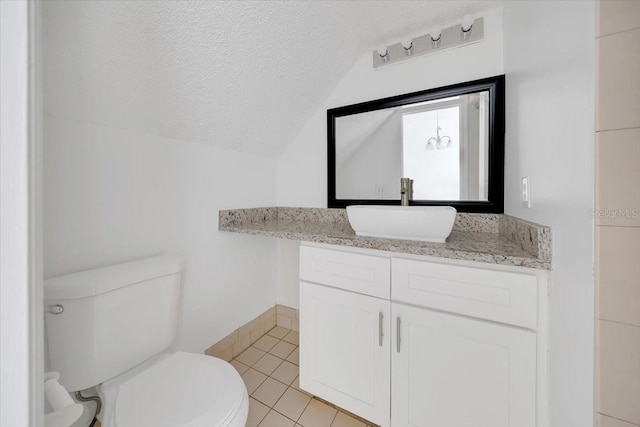 329 Marion Oaks Blvd Unit A3, Ocala, FL 34473 - bathroom with lofted ceiling, vanity, tile patterned floors, and a textured ceiling