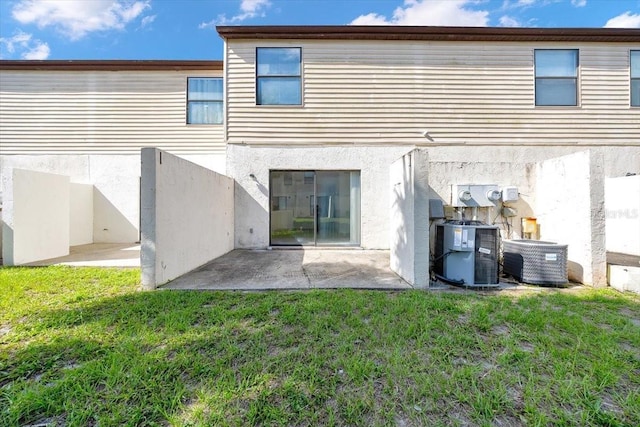 329 Marion Oaks Blvd Unit A3, Ocala, FL 34473 - back of property with a patio, stucco siding, and a lawn