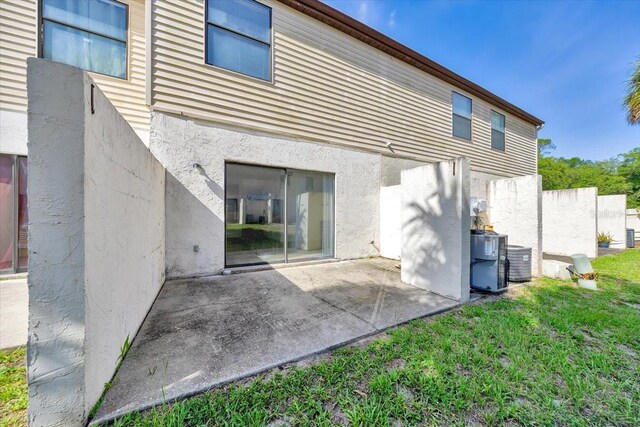 329 Marion Oaks Blvd Unit A3, Ocala, FL 34473 - rear view of house with a patio area, stucco siding, and a yard