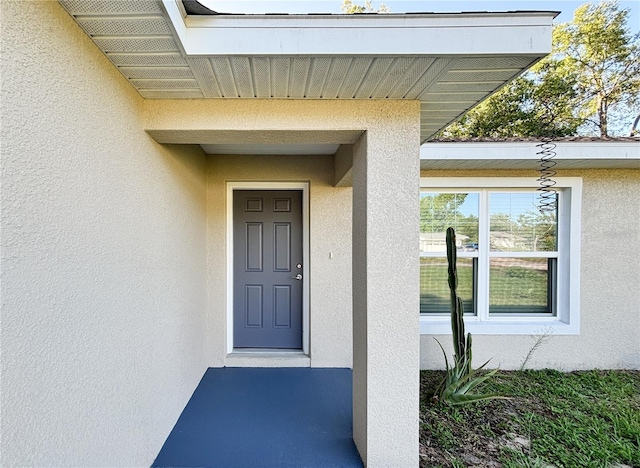 10347 N Halsey Way, Dunnellon, FL 34434 - property entrance featuring stucco siding