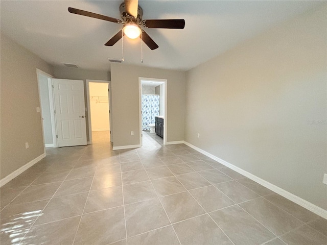 10347 N Halsey Way, Dunnellon, FL 34434 - spare room with light tile patterned floors and ceiling fan