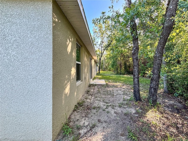 10347 N Halsey Way, Dunnellon, FL 34434 - view of property exterior featuring stucco siding