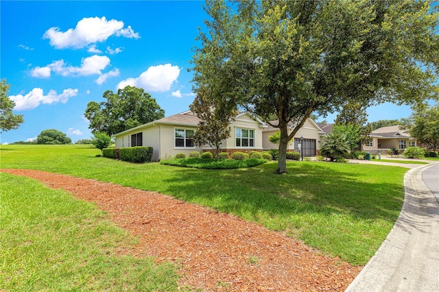 9925 SW 95th Loop, Ocala, FL 34481 - single story home with a garage, stucco siding, and a front yard