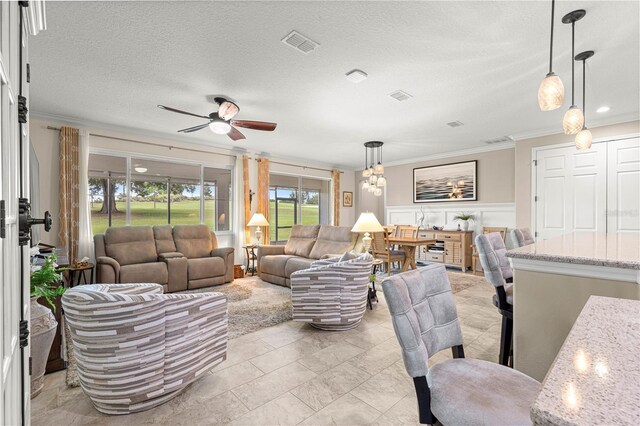9925 SW 95th Loop, Ocala, FL 34481 - living room featuring ornamental molding, ceiling fan, and a textured ceiling