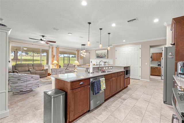 9925 SW 95th Loop, Ocala, FL 34481 - kitchen featuring stainless steel appliances, crown molding, a kitchen island with sink, a ceiling fan, and light stone counters
