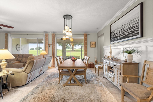 9925 SW 95th Loop, Ocala, FL 34481 - dining space featuring crown molding, a chandelier, and ceiling fan